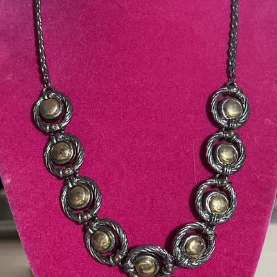 Silver toned necklace with gold circles