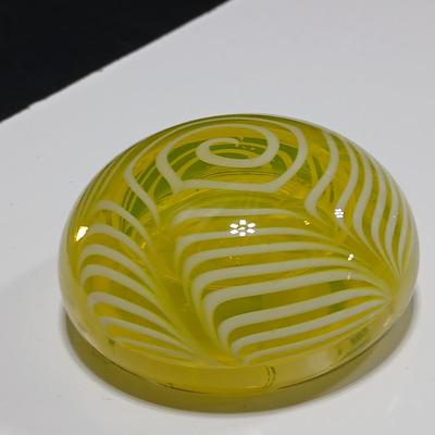 Yellow glass floral swirl paperweight