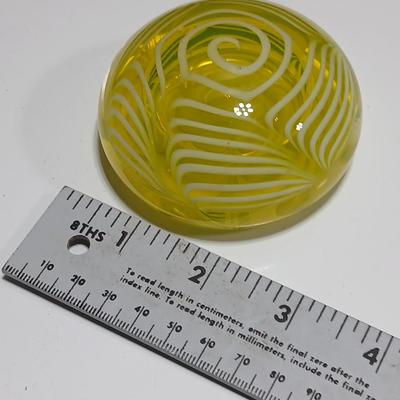 Yellow glass floral swirl paperweight