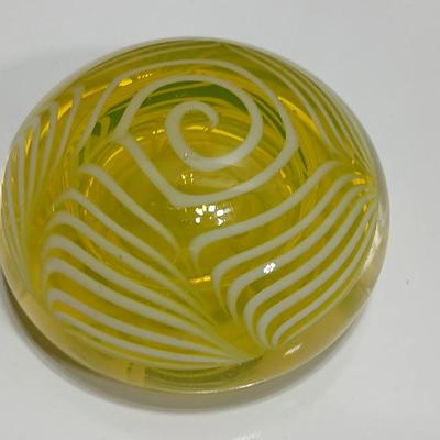 Yellow glass floral swirl paperweight