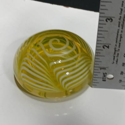 Yellow glass floral swirl paperweight