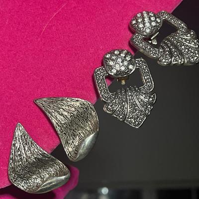 Big silver toned clip on earrings