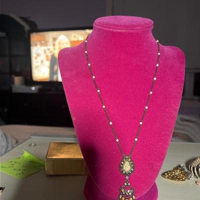 Golden toned pendant necklace