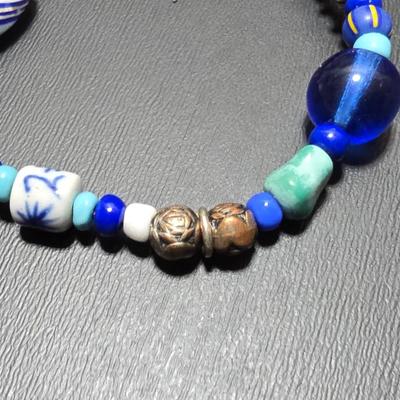 Red and Blue beaded bracelets with elephant charm and trade beads