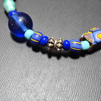Red and Blue beaded bracelets with elephant charm and trade beads