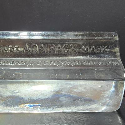 Vintage glass Madeira Hill & Co. paperweight and an Advertising Trade Adairack Mark Glass paperweight