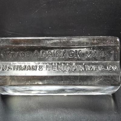 Vintage glass Madeira Hill & Co. paperweight and an Advertising Trade Adairack Mark Glass paperweight