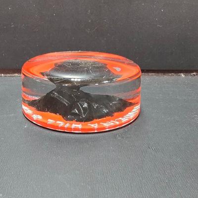 Vintage glass Madeira Hill & Co. paperweight and an Advertising Trade Adairack Mark Glass paperweight