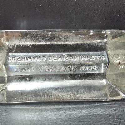 Vintage glass Madeira Hill & Co. paperweight and an Advertising Trade Adairack Mark Glass paperweight