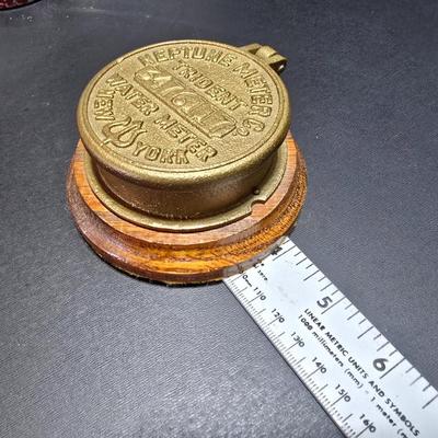 Neptune Meter Co Tribute water meter replica paperweight and a Babbitt metal /lead paperweight