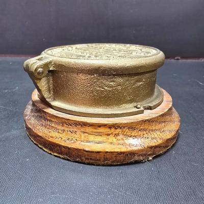 Neptune Meter Co Tribute water meter replica paperweight and a Babbitt metal /lead paperweight