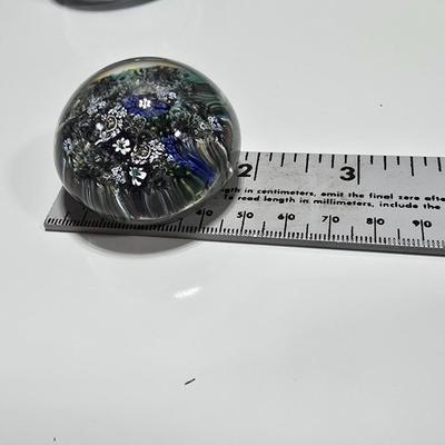 Two decorative glass paperweights - floral and art deco