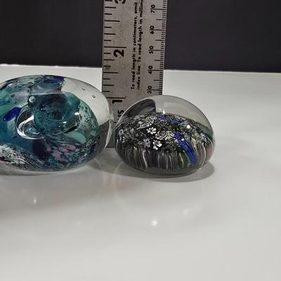 Two decorative glass paperweights - floral and art deco