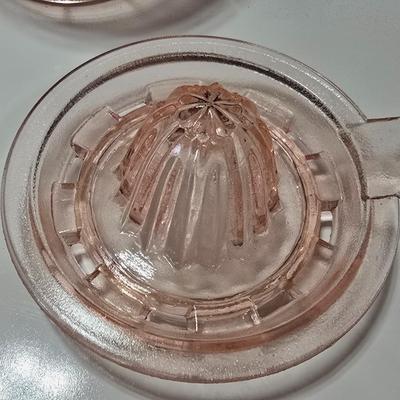 Pink depression glass divided dish, platter, and Juice reamer with measuring glass cup
