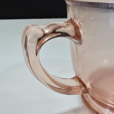 Pink depression glass divided dish, platter, and Juice reamer with measuring glass cup