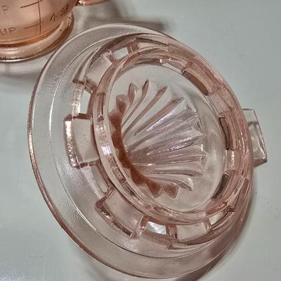 Pink depression glass divided dish, platter, and Juice reamer with measuring glass cup