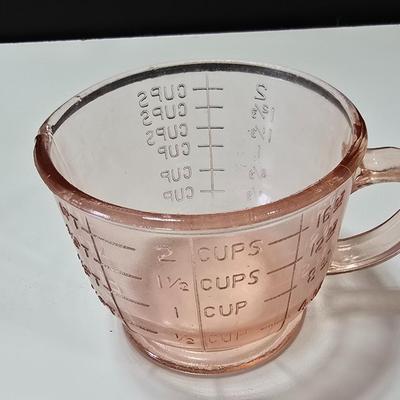 Pink depression glass divided dish, platter, and Juice reamer with measuring glass cup