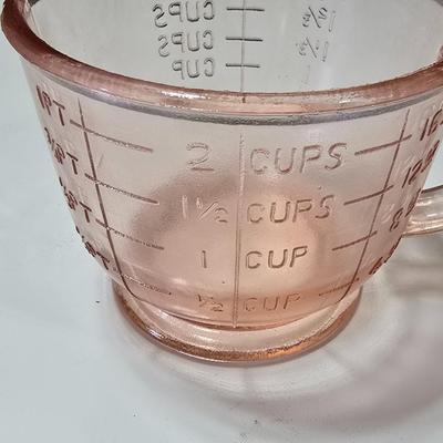 Pink depression glass divided dish, platter, and Juice reamer with measuring glass cup