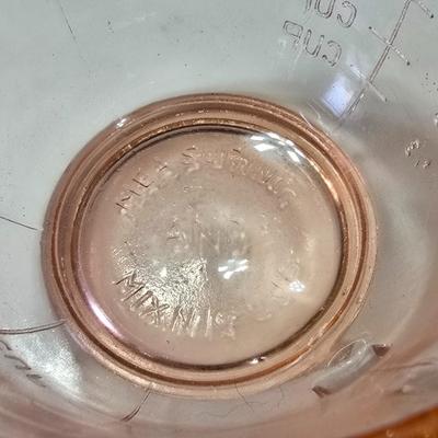 Pink depression glass divided dish, platter, and Juice reamer with measuring glass cup