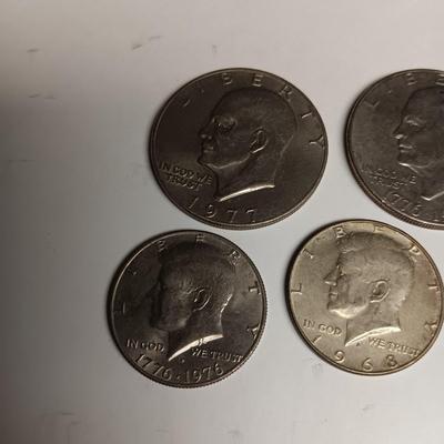 TWO EISENHOWER DOLLARS AND 3 KENNEDY HALF DOLLARS
