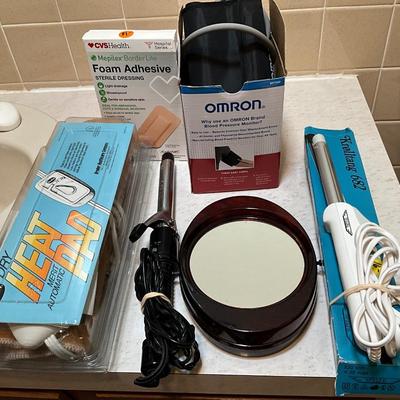 Blood pressure monitor, heating pad, curling irons