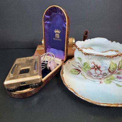 LOT 55: Vintage Audivox, Inc., Micronic Model #303, Antique Brandenburg Porcelain Mustache Cup, Gillett Razor, Schnefel Bros. Straight...