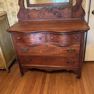 LOT 79: Anique Tiger Oak Drawer Dresser