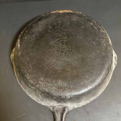 LOT 88: Griswold Cast Iron Pan, Cast Iron Corn & Gingerbread Man Baking Molds, Small Cast Iron Fry Pan & Tin Muffin Pan