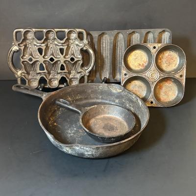 LOT 88: Griswold Cast Iron Pan, Cast Iron Corn & Gingerbread Man Baking Molds, Small Cast Iron Fry Pan & Tin Muffin Pan