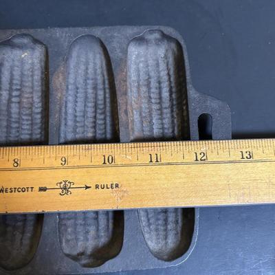 LOT 88: Griswold Cast Iron Pan, Cast Iron Corn & Gingerbread Man Baking Molds, Small Cast Iron Fry Pan & Tin Muffin Pan