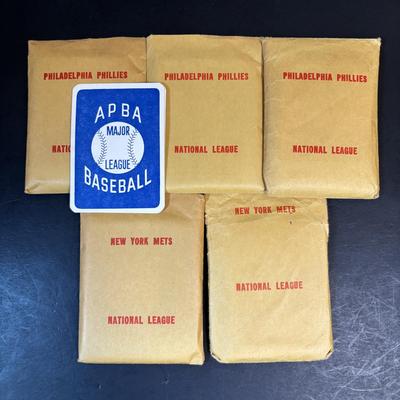 LOT 94: Mets & Phillies Collection: Yearbooks, Ticket Stub, Mug, Vintage Rule Book along with APBA Game Card Packets