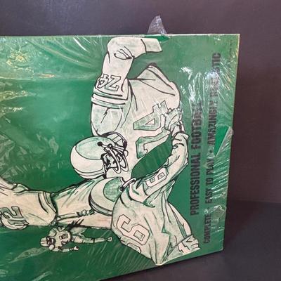 LOT 93: Booth's Pro Conference Football Game - UNOPENED