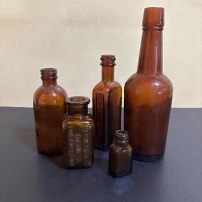 LOT 103: Vintage Brown & Clear Bottle Collection