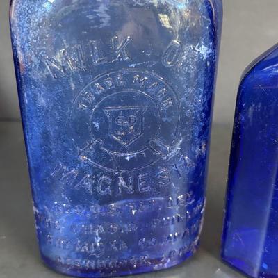 LOT 104: Vintage Cobalt Blue Bottles & Clear Glass Beaker
