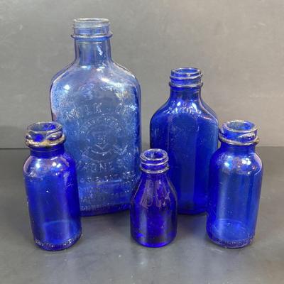LOT 104: Vintage Cobalt Blue Bottles & Clear Glass Beaker