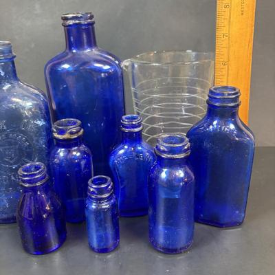 LOT 104: Vintage Cobalt Blue Bottles & Clear Glass Beaker