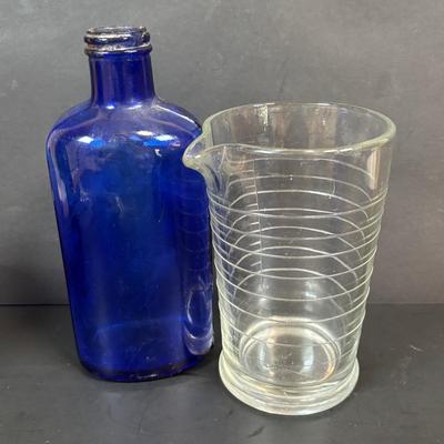 LOT 104: Vintage Cobalt Blue Bottles & Clear Glass Beaker