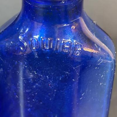 LOT 104: Vintage Cobalt Blue Bottles & Clear Glass Beaker