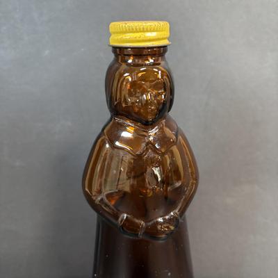 LOT 105: Vintage Kitchen: Mrs. Butterworth Syrup Bottle, Kitchen Prayer Plate, Tins, Atlas Canning Jar & Ceramic Bear Honey Pot