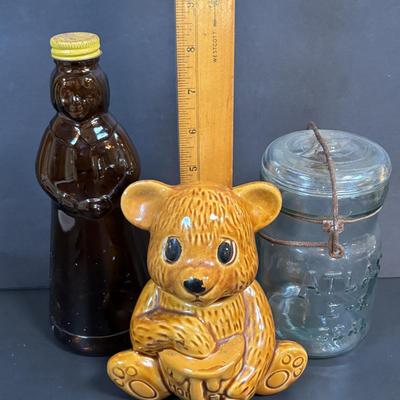 LOT 105: Vintage Kitchen: Mrs. Butterworth Syrup Bottle, Kitchen Prayer Plate, Tins, Atlas Canning Jar & Ceramic Bear Honey Pot