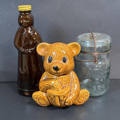LOT 105: Vintage Kitchen: Mrs. Butterworth Syrup Bottle, Kitchen Prayer Plate, Tins, Atlas Canning Jar & Ceramic Bear Honey Pot