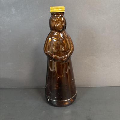 LOT 105: Vintage Kitchen: Mrs. Butterworth Syrup Bottle, Kitchen Prayer Plate, Tins, Atlas Canning Jar & Ceramic Bear Honey Pot