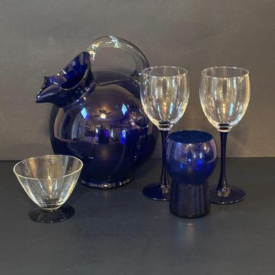 LOT 107: Beautiful Cobalt Blue Tilt-Ball Pitcher w/Clear Handle & 1 Tumbler, Blue Stemmed Wine Glasses,
