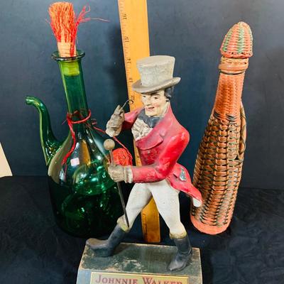 LOT 247: For the Bar Collection Featuring an Antique/Vintage Johnnie Walker Scotch Wooden Walking Man Display Figurine and Two (2) Decanters