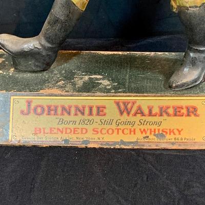 LOT 247: For the Bar Collection Featuring an Antique/Vintage Johnnie Walker Scotch Wooden Walking Man Display Figurine and Two (2) Decanters