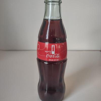 LOT 101K: Classic Coca Cola Bottles and Miniature Lunch Metal Pail