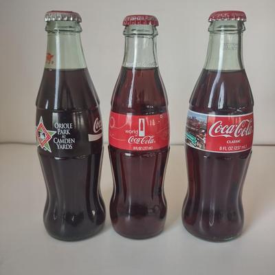 LOT 101K: Classic Coca Cola Bottles and Miniature Lunch Metal Pail