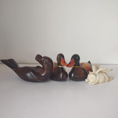 LOT 102K: Signed Wooden Mallard Ducks and Otter Paper Weights along with a Vintage Cast Iron Flying Pig