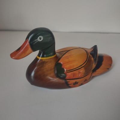 LOT 102K: Signed Wooden Mallard Ducks and Otter Paper Weights along with a Vintage Cast Iron Flying Pig