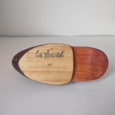 LOT 102K: Signed Wooden Mallard Ducks and Otter Paper Weights along with a Vintage Cast Iron Flying Pig